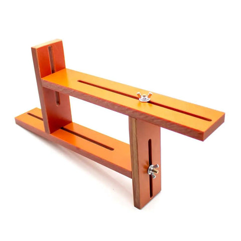 Adjustable Battery Spot Weld Jig For 18650 And 26650 Cells With Flexible Array Layout, orange Bakelite design, adjustable height.