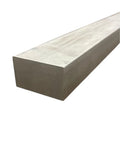 Close-up of one and a half by two and a half by twelve inch true flat bar in 17-4 stainless steel hot rolled for weldable DIY projects