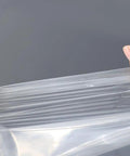 Clear Flower Water Bags Pro Grade 100 Pack Transparent Wrapping Sleeves close-up view showing plastic durability and transparency.
