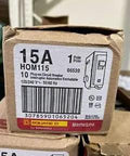 Box of 10 Pack 15 Amp 120/240V Single Pole Plug-In Circuit Breakers with label showing model and specifications for DIY home wiring.