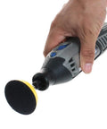 Hand holding a drill with a sanding disc from the 100 Pack 2 Inch Sanding Discs Kit With Polishing Pad Plate, Assorted Grits 40 Through 400.