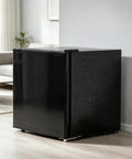 Black Compact Upright Mini Freezer 1.1 Cu Ft Adjustable Thermostat Dial, sleek design in living space showcasing countertop storage.