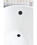 Bathtub with Brass Bathtub Drain Kit With Lift And Turn Mechanism, Single Hole Overflow Faceplate in Matte Black Finish installed
