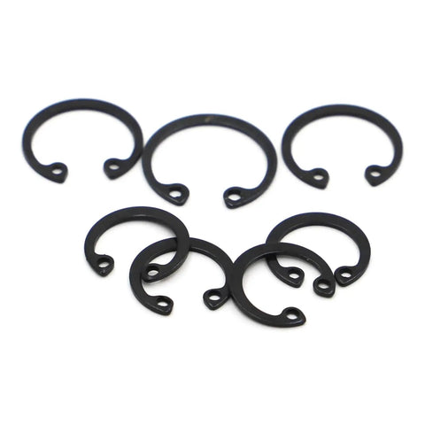 Rock Solid Black Internal Retaining Rings And C Clips M8 Through M50 Shaft Circlips arranged in various sizes, carbon steel material.