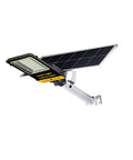 Heavy Duty Outdoor Solar LED Flood Light With Remote Mounting Bracket Auto Dusk To Dawn Sensor on wall, showcasing solar panel.