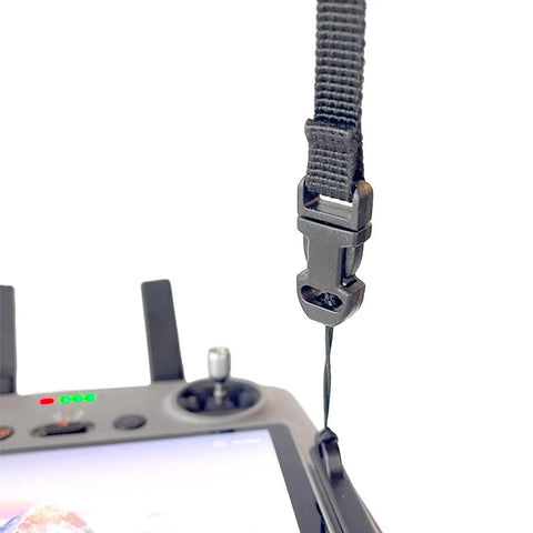 Close-up of controller with black claw lanyard attachment for Mini 4 Pro Drone Fly More Combo With Dope Claw Lanyard Mounting System