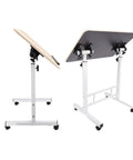 Mobile Adjustable Standing Desk With Scratch Resistant White Maple Surface And Sturdy Metal Base Rock Solid Height Adjustable mobile workstation with wheels.