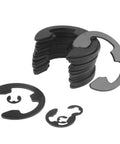 Stacked black alloy steel E clip snap rings from Pro Grade 300 Piece External Retaining Ring Kit in nine sizes 3 mm to 22 mm.