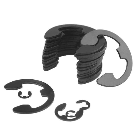 Stacked black alloy steel E clip snap rings from Pro Grade 300 Piece External Retaining Ring Kit in nine sizes 3 mm to 22 mm.