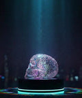 LED Skull Table Lamp With Gothic Glow Battery Powered Three AAA Batteries Needed on a dark table with ambient light