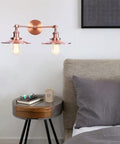 Badass Industrial Vintage Dual Light Wall Sconce Featuring Adjustable Metal Arms For Instant Room Upgrades Rock Solid Construction Easy Install In Stunning Chrome Or Sleek Matte Black Finishes Today with copper finish in a bedroom setting.