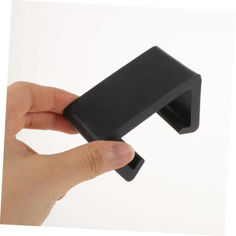 Person holding black outdoor furniture clip. Super Practical Outdoor Patio Furniture Clips Keep Your Sectional Couch Pieces Secure And Neat Prevent