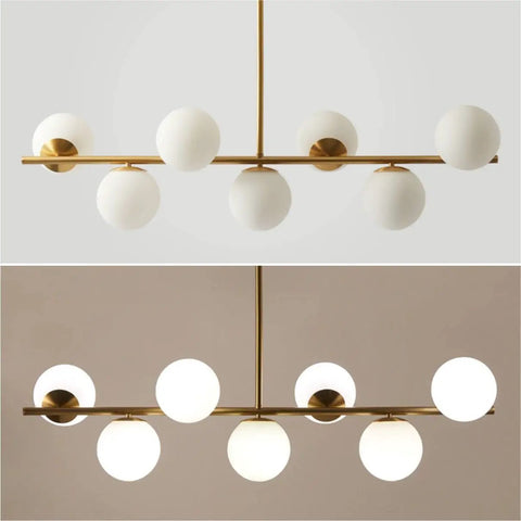 Groovy Mid Century Modern Pendant Light Set Featuring Sleek Glass Globes and Gold Finish Perfect for Kitchen Island or Dining Room with Seven Bulbs for a Rad Lighting Vibe and Dimmable LED Compatibility showcasing white glass globes.