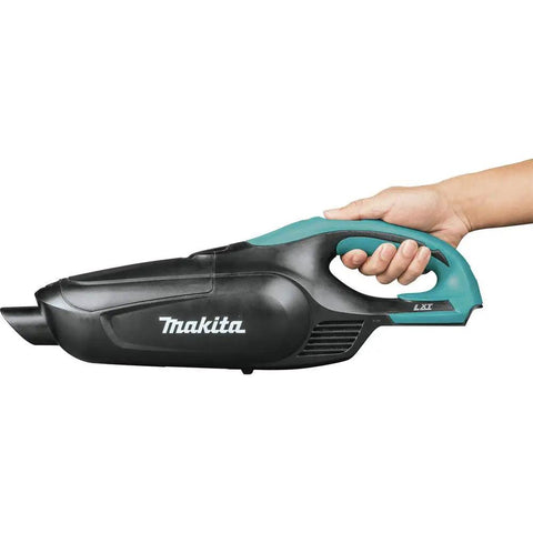 Hand holding 18V LXT Cordless Vacuum for Workshop and Home, ergonomic design with push button controls, tool only view.