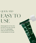 Toothpaste turn-key metal tube squeezer shown with a green toothpaste tube and metal roller lever