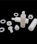 M3 Nylon Hex Spacer Kit 250-Piece Standoff Set For PCBs Motherboards Drones And Quads Non-Conductive Lightweight Black And White Nylon Spacers With Screws Nuts And Washers Included, white nylon standoffs and washers on black background