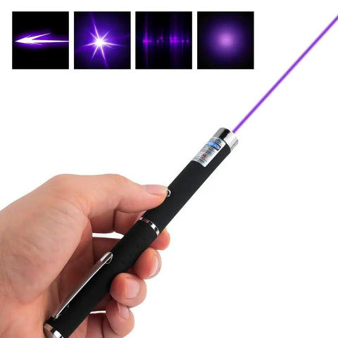 Hand holding a purple laser pointer for Three Pack Laser Pointer For Cats And Dogs Interactive Pet Toy Set With Red Green And Purple Lights Great For Playtime And Training Requires Two AAA Batteries Not Included.