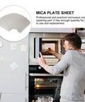 Man installing heat resistant mica waveguide cover in microwave, 4.57x2.56 inch pad as durable replacement part for oven repair.