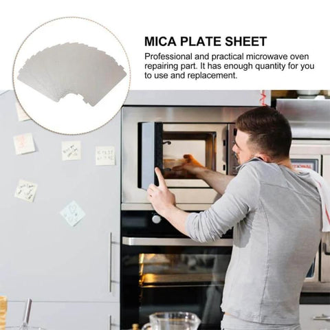 Man installing heat resistant mica waveguide cover in microwave, 4.57x2.56 inch pad as durable replacement part for oven repair.