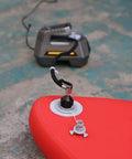 Inflatable Boat And Stand Up Paddle Board Pump Adapter For Schrader Valve No Fuss Universal Connector attached to a red inflatable