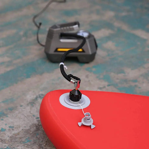 Inflatable Boat And Stand Up Paddle Board Pump Adapter For Schrader Valve No Fuss Universal Connector attached to a red inflatable