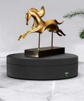 Luxury Electric Rotating Jewelry Display Stand With Mirrored Base, Smooth Spin Turntable For Rings, Necklaces & Watches on a black surface.