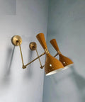 1950 Mid Century Italian Hardwire Brass Wall Sconce Pair Brown Wall Fixture Diabolo Lamp with dual conical shades mounted on the wall.