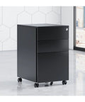 Sturdy Steel File Cabinet With Three Drawers And Lock in black, shown in office, space saving design for home or workplace use.