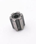Front view of metal poppet valve component for waterjet cutting machines; hexagonal body with central bore.