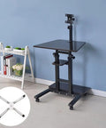 Height Adjustable Standing Laptop Desk With Smooth Rolling Wheels For An Ergonomic Sit Stand Workspace That Brings A Hella Fresh Vibe To Small Bedrooms And Cozy Home Office Setups, showcasing black top and smooth wheels.