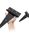 Badass 10 Inch Heavy Duty Gate Hinges 2 Pack Wrought Iron T Straps for Barn Doors and Sheds in a hand with black finish.