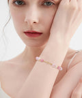 Woman wearing bracelet with 80Pcs Pro Grade Bead Tips Knot Covers 18K Gold Plated Brass Clamshell End Cap on wrist