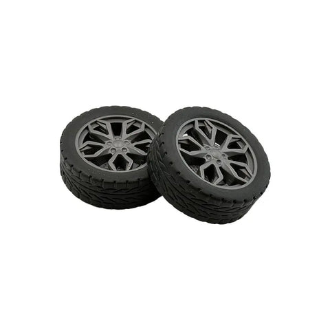 Close-up of rubber wheels from 10 Piece Toy Wheel Set For DIY RC Cars And Robots Includes 5 Round Shaft Axles Rubber Wheels 38mm Diameter And 2.5mm Shaft Dope Build Ready For Model Trucks And DIY Bot Builds