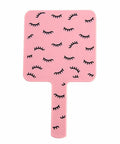 Pink Mini Handheld Lash Mirror For Eyelash Extensions Anti Fog Beauty Mirror with eyelash pattern on pink surface.