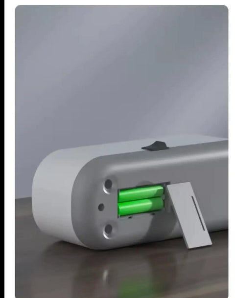Pro Grade Ultrasonic Jewelry Cleaner battery compartment showing green batteries and sleek design