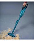 Cordless 18V Li Ion Vacuum Cleaner Body Only for Vehicles and Jobsites in use on wood shavings, lightweight design.