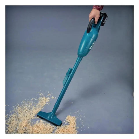 Cordless 18V Li Ion Vacuum Cleaner Body Only for Vehicles and Jobsites in use on wood shavings, lightweight design.