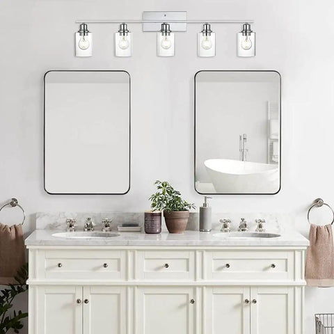 Five Light Chrome Vanity Fixture With Clear Cylinder Glass Shades for bathroom above dual mirrors.