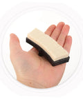 Universal Indoor Bike Brake Pads For Stationary Cycles held in hand, beige and black material, replacement part for fitness cycling