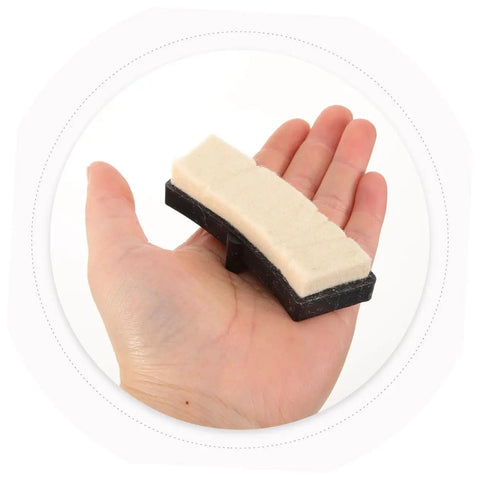 Universal Indoor Bike Brake Pads For Stationary Cycles held in hand, beige and black material, replacement part for fitness cycling