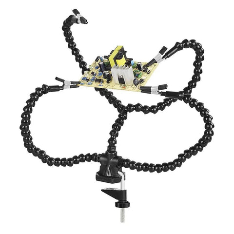 Helping Hands Soldering Third Arm Tool with flexible arms and desk clamp base holding PCB for soldering and repair.