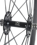 Close-up of a hub on a 50mm Carbon Fiber Track Wheel Set Matte Finish 3K Fixed Gear Wheelset With Cog Built For Speed Junkies And Long Rides