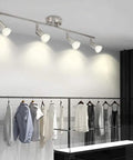 Sleek Modern LED 4-Light Track Lighting Kit With Flush Mount for wall or ceiling illuminating clothing in a modern retail space