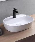 USZWBY Vessel Sinks Minimalist Ceramic Table Basin Home Hotel Bathroom Washbasin Large Pool Bathroom Bowl Sink with black faucet.