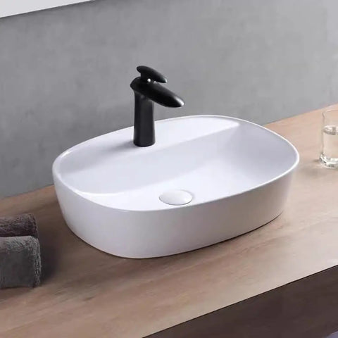 USZWBY Vessel Sinks Minimalist Ceramic Table Basin Home Hotel Bathroom Washbasin Large Pool Bathroom Bowl Sink with black faucet.