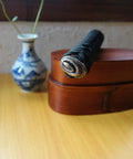 End of Dope DIY Tsuka Sword Handle Kit Ten Point Two Inch For Samurai Katana on display with alloy fittings, hardwood core.