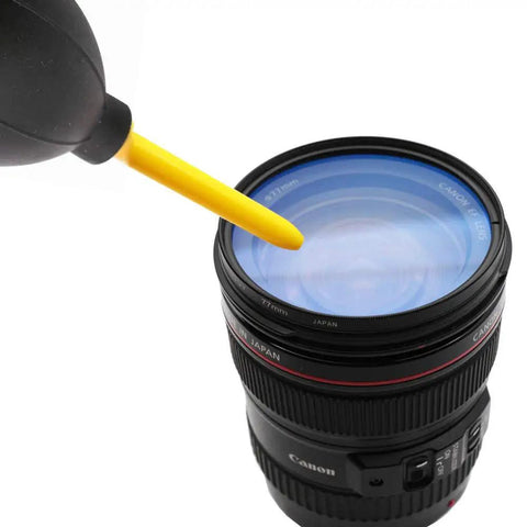 Dope Dust Blower And Air Cleaner For DSLR Cameras Camcorders And Lenses With Microfiber Cloth in use on camera lens