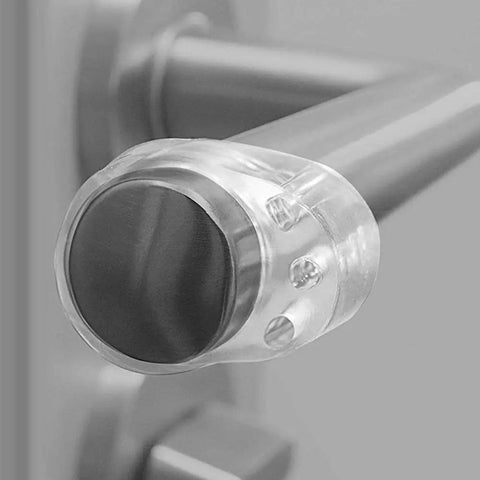 Close-up of a 4 Pack Clear Silicone Door Stopper Guard on a handle for wall and cabinet protection, shockproof buffer pad.