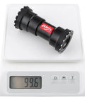 Threaded Press Fit Bottom Bracket For BB86 BB92 Frames To 24mm Cranks For MTB And Road Bikes, shown on digital scale