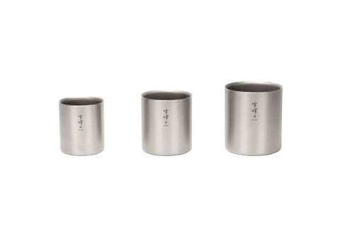 Dope Titanium Double Wall Insulated Coffee Mug With 15 Oz Capacity, three sizes of titanium mugs stacked together.